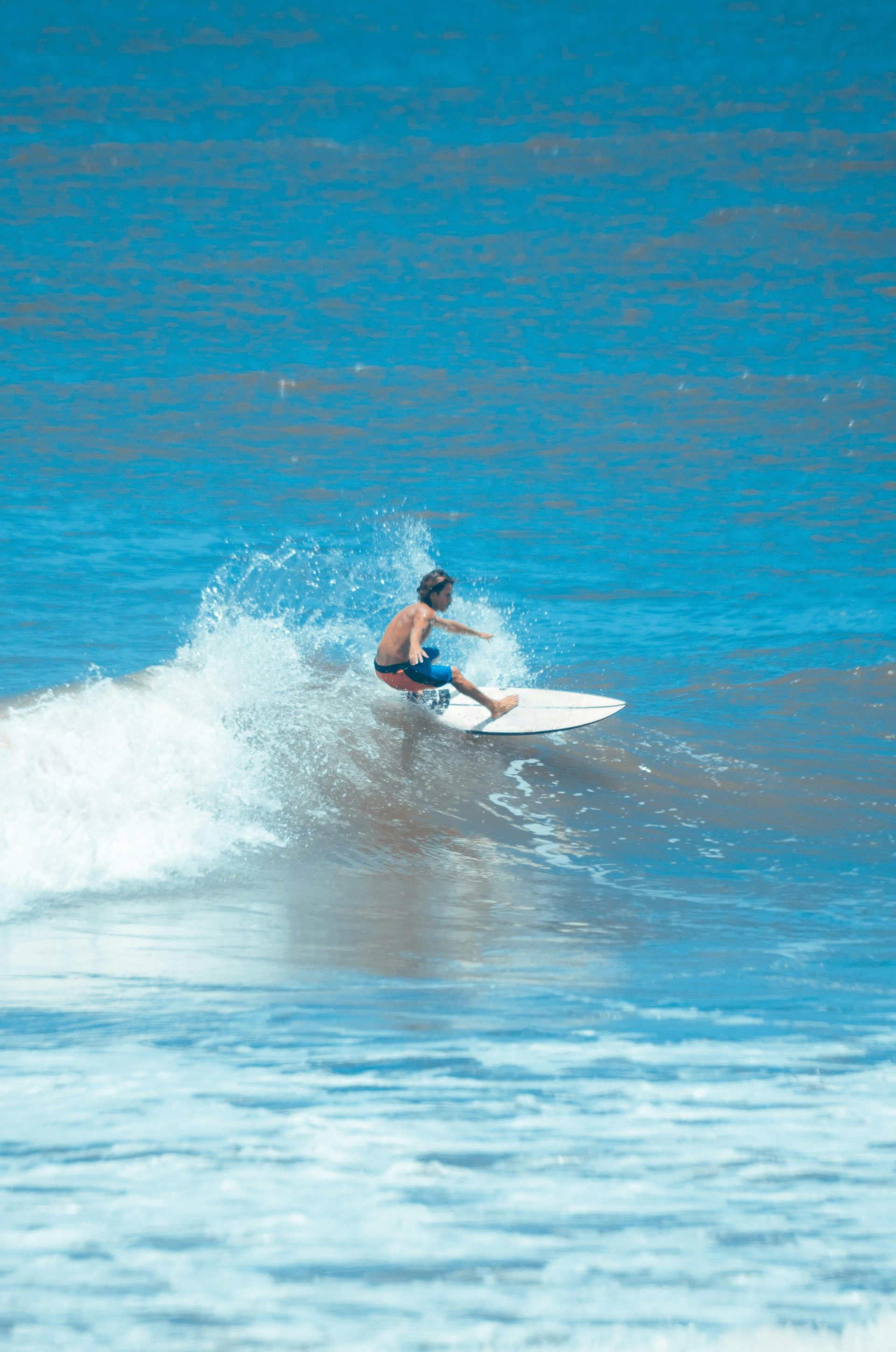 a man riding a surfboard